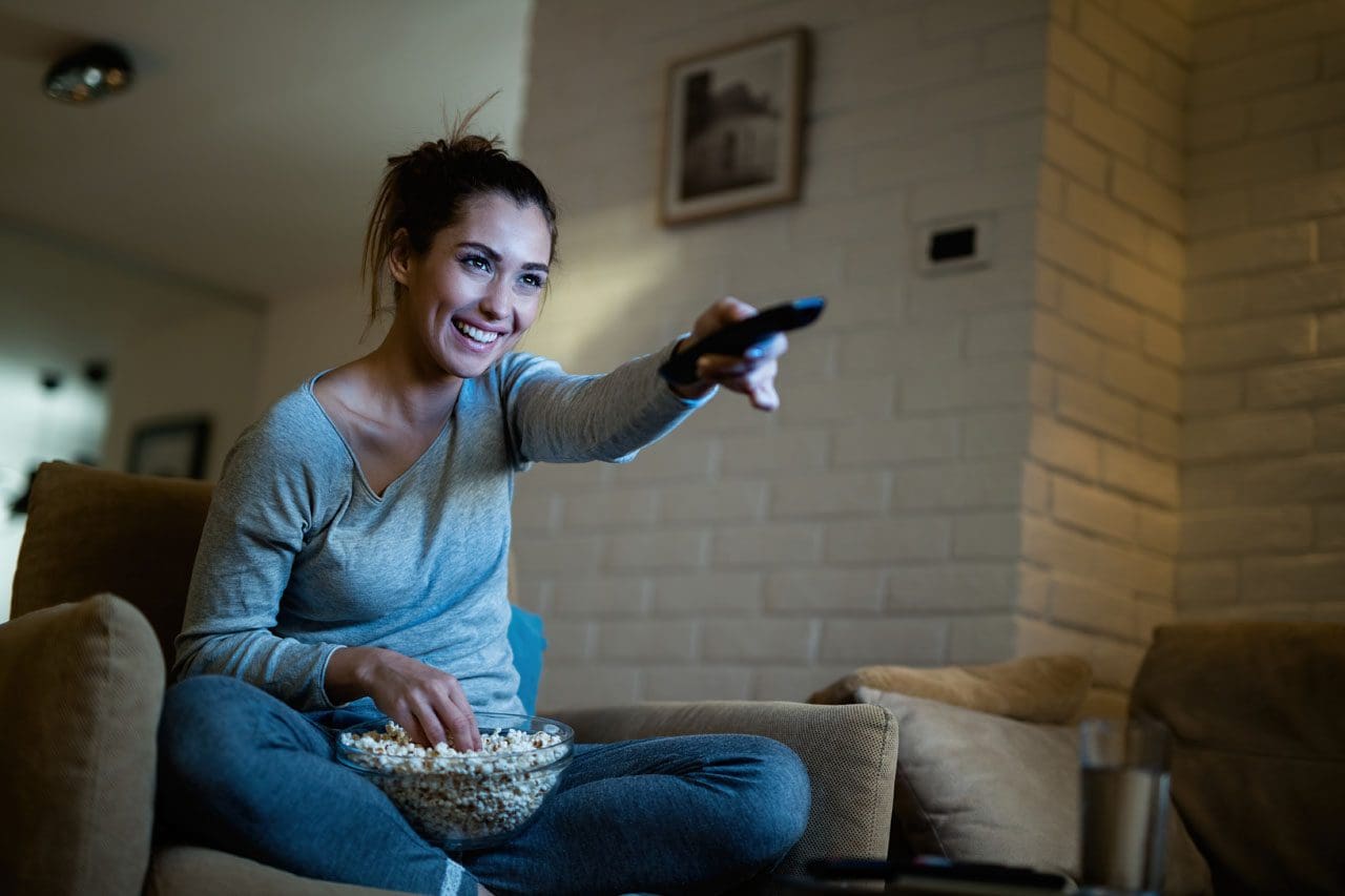 https://elpasobackclinic.com/wp-content/uploads/2023/05/happy-woman-using-remote-control-while-watching-tv-2022-09-23-23-16-21-utc_02.jpg